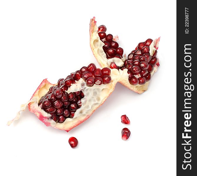 Piece of pomegranate on the white. Piece of pomegranate on the white