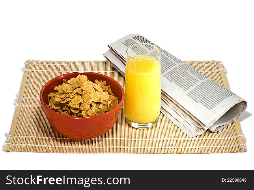 Juice, cereal and the newspaper on white background. Juice, cereal and the newspaper on white background