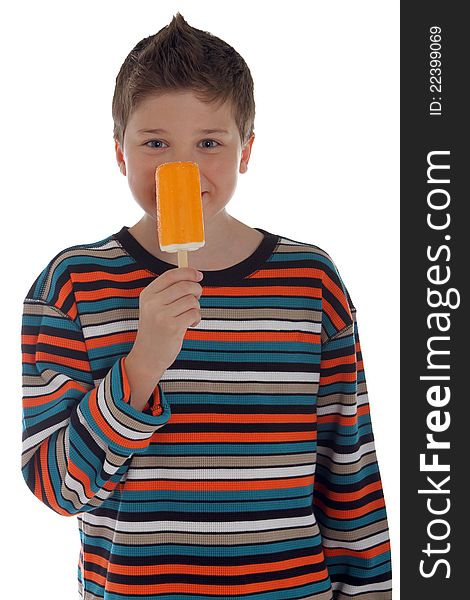 Young boy holding a popsicle to his nose. Young boy holding a popsicle to his nose