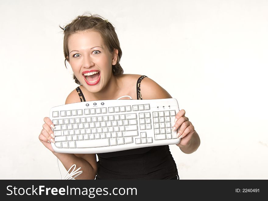 Excited pretty woman holding a keyboard. Excited pretty woman holding a keyboard