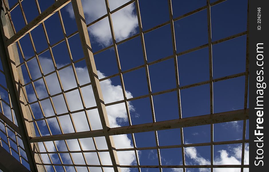 Clouds after the rain as seen through restrictive bars. Clouds after the rain as seen through restrictive bars.