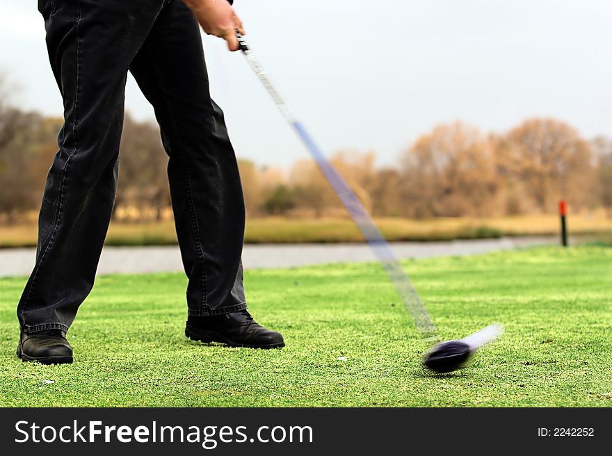 Impact to a golf ball off the tee. Impact to a golf ball off the tee