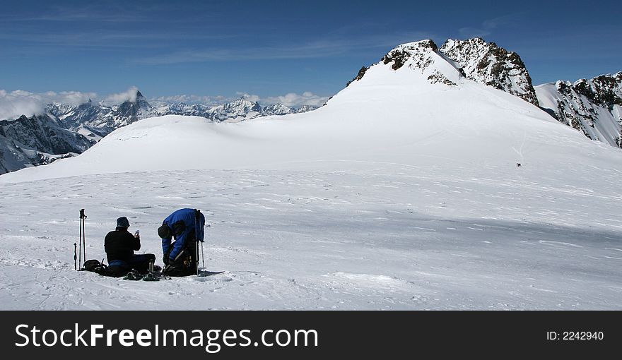 Climbers resting on a mountain plateau. Climbers resting on a mountain plateau