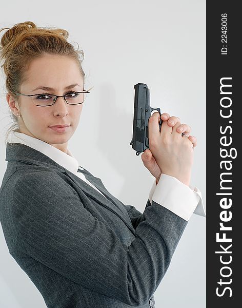 Woman in office with toy gun. Woman in office with toy gun