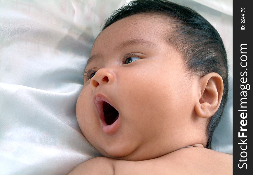 Two month old baby yawning. Two month old baby yawning.