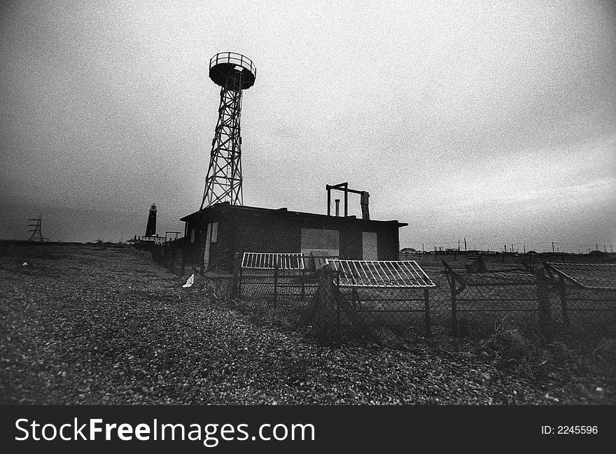 Deserted derelict bulding on power staion site. shot on bw film with grain. Deserted derelict bulding on power staion site. shot on bw film with grain