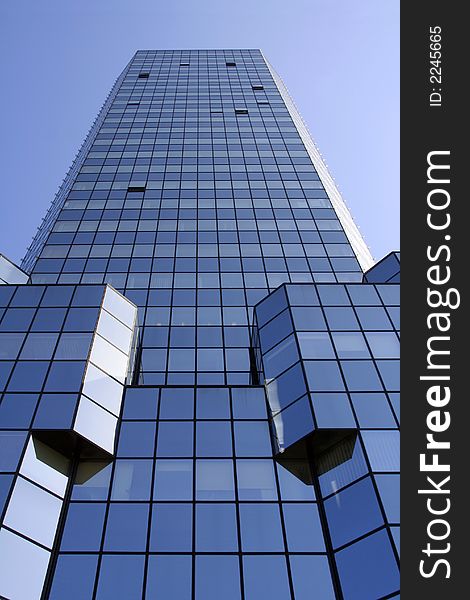 Blue skyscraper shot at a vertical angle perspective. Blue skyscraper shot at a vertical angle perspective