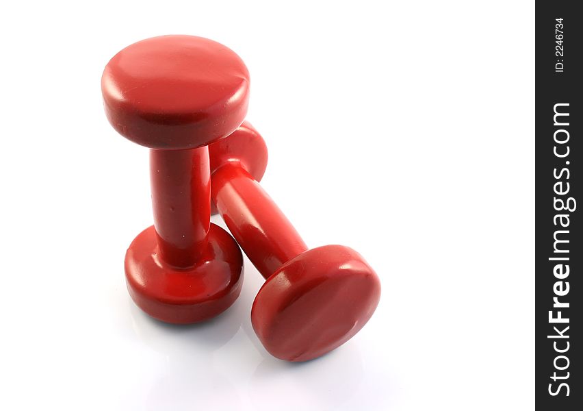 A set of weight training Dumbbells on a white background. A set of weight training Dumbbells on a white background