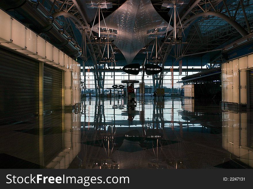 People silhouette in the waiting lounge in airport