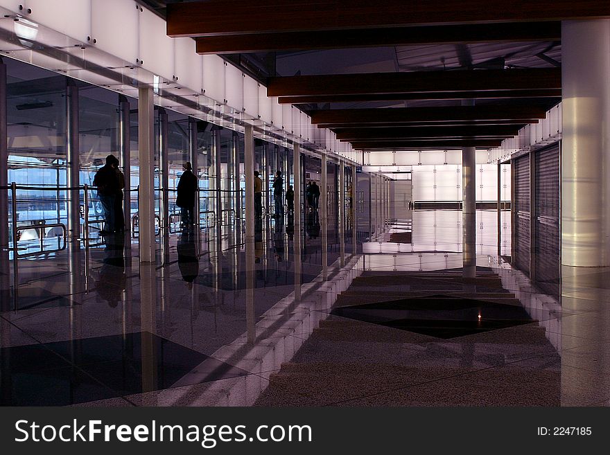 People silhouette in the waiting lounge in airport