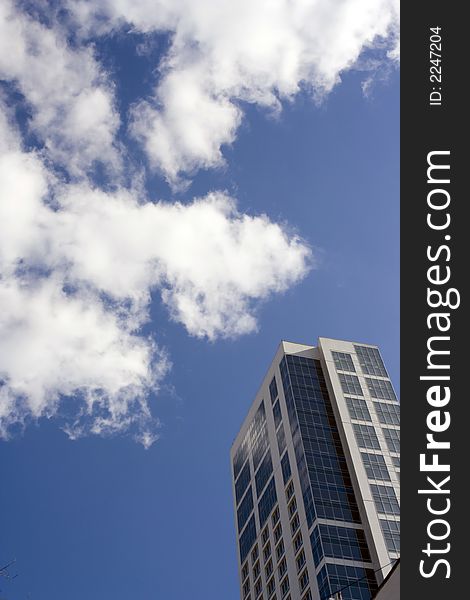 The dark blue sky and clouds. Glass and concrete. The dark blue sky and clouds. Glass and concrete.