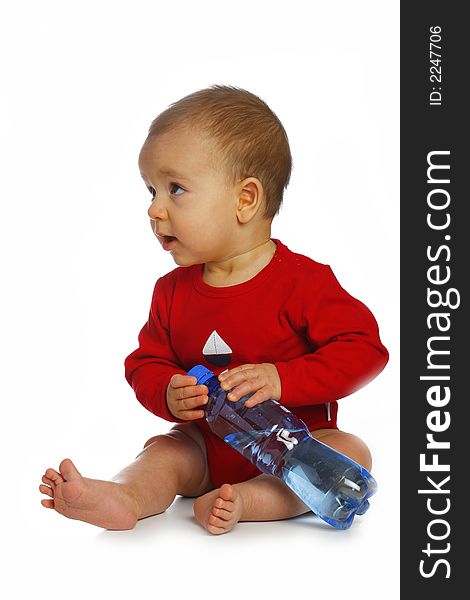 Sitting baby with bottle of clean water