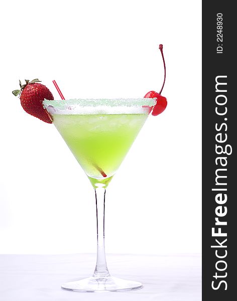 Colorful alcoholic cocktail in a martini glass against white background. Colorful alcoholic cocktail in a martini glass against white background