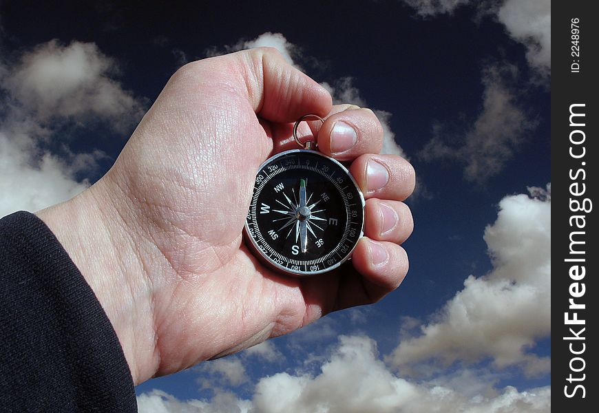 Compass in hand isolated