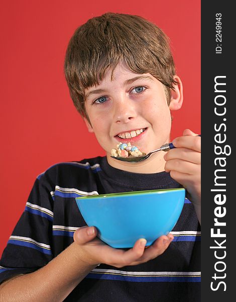 Shot of a boy eating cereal vertical