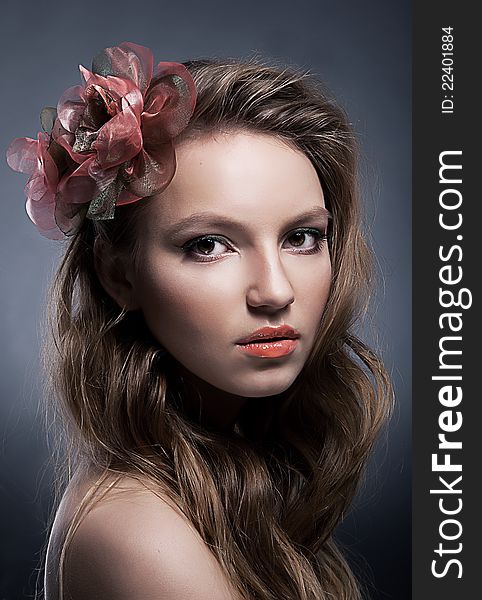 Art portrait of young lovely female with bow close up. Art portrait of young lovely female with bow close up