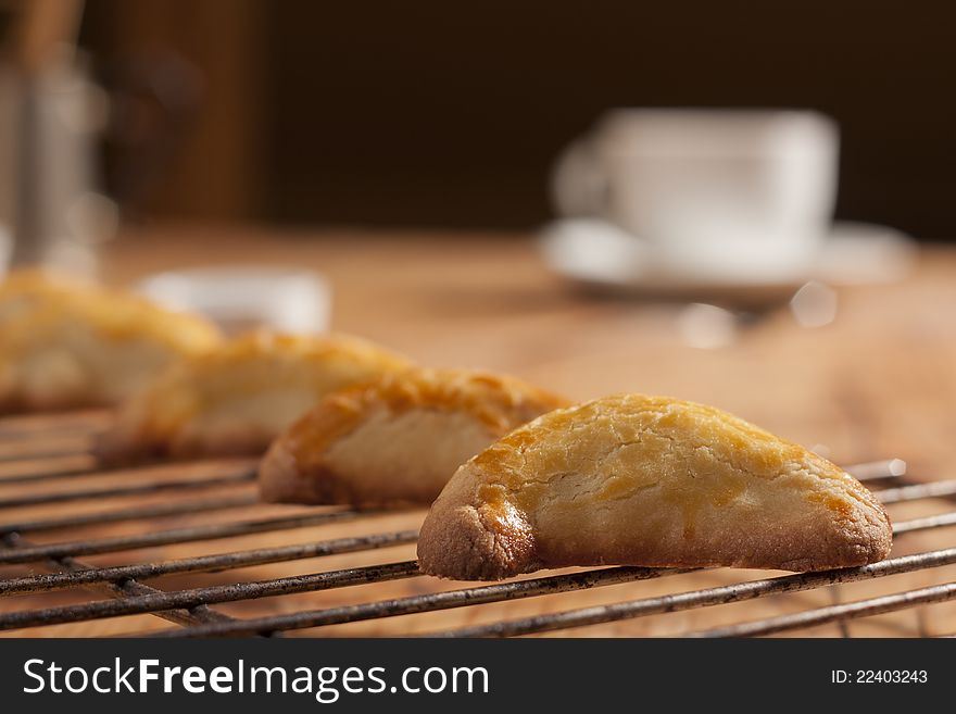 Warm, golden brown, pasty cooling on a rack. Shallow depth of field. Warm, golden brown, pasty cooling on a rack. Shallow depth of field.