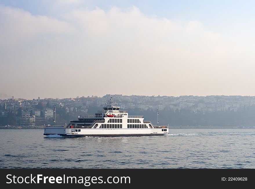 Photo of a ferry crossing Bosphorus. It's built for carrying cars through sea. Photo of a ferry crossing Bosphorus. It's built for carrying cars through sea.