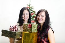 Christmas: Two Girls With Gifts Stock Image
