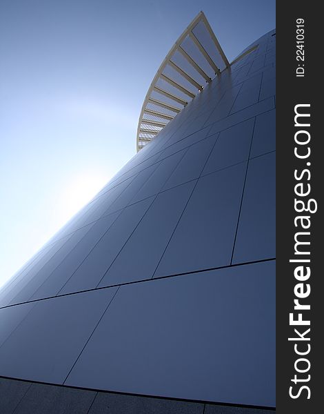 Sun behind futuristic building with staircase. Sun behind futuristic building with staircase