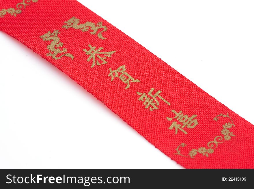Red bow and chinese alphabet on white background