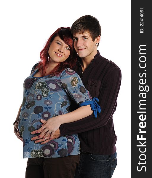 Young Couple Expecting hugging and smiling  isolated on a white background. Young Couple Expecting hugging and smiling  isolated on a white background