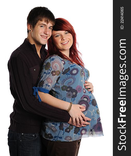 Young Couple Expecting hugging and smiling isolated on a white background. Young Couple Expecting hugging and smiling isolated on a white background