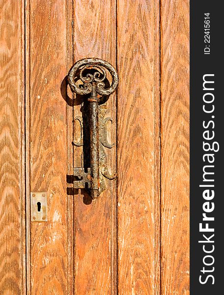 The old door handle in the form of key  in the Spanish coastal town.