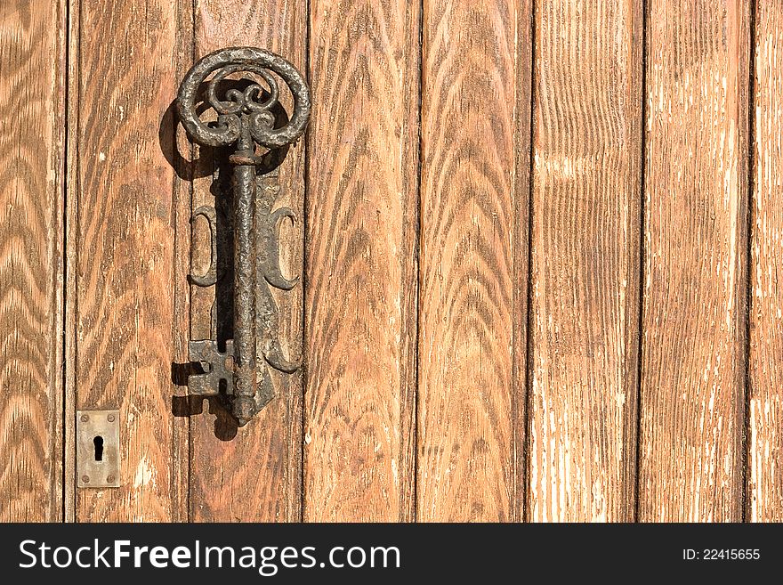 The old door handle in the form of key  in the Spanish coastal town.