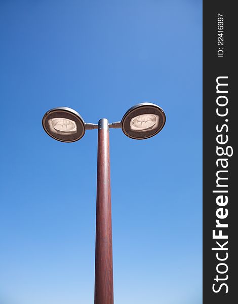 Double modern streetlamp in a street of Madrid city Spain