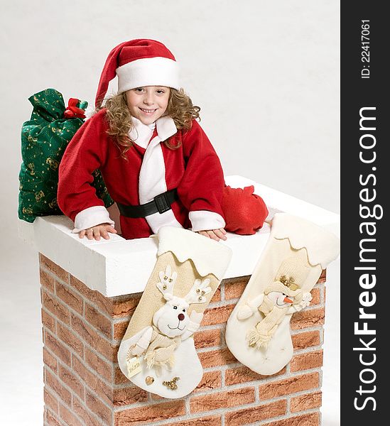 Portrait of Christmas baby in Santa hat