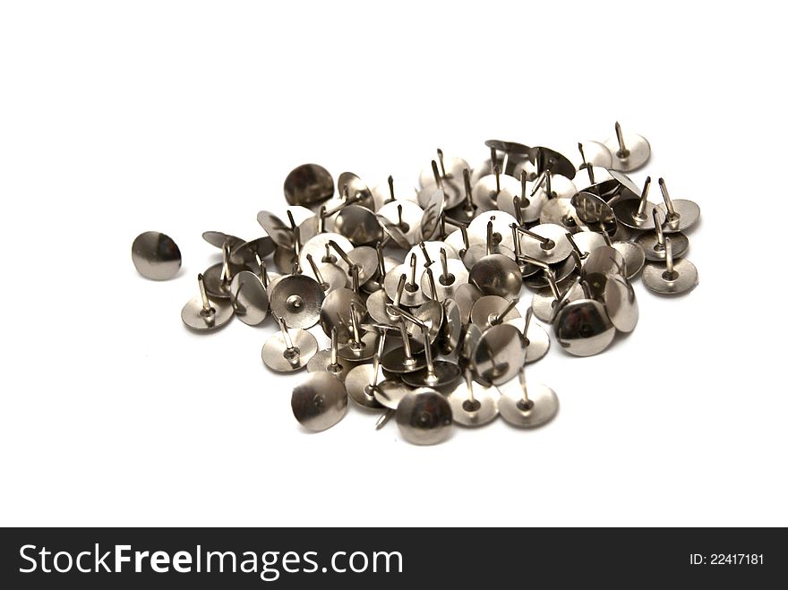 Silver pushpin on white background