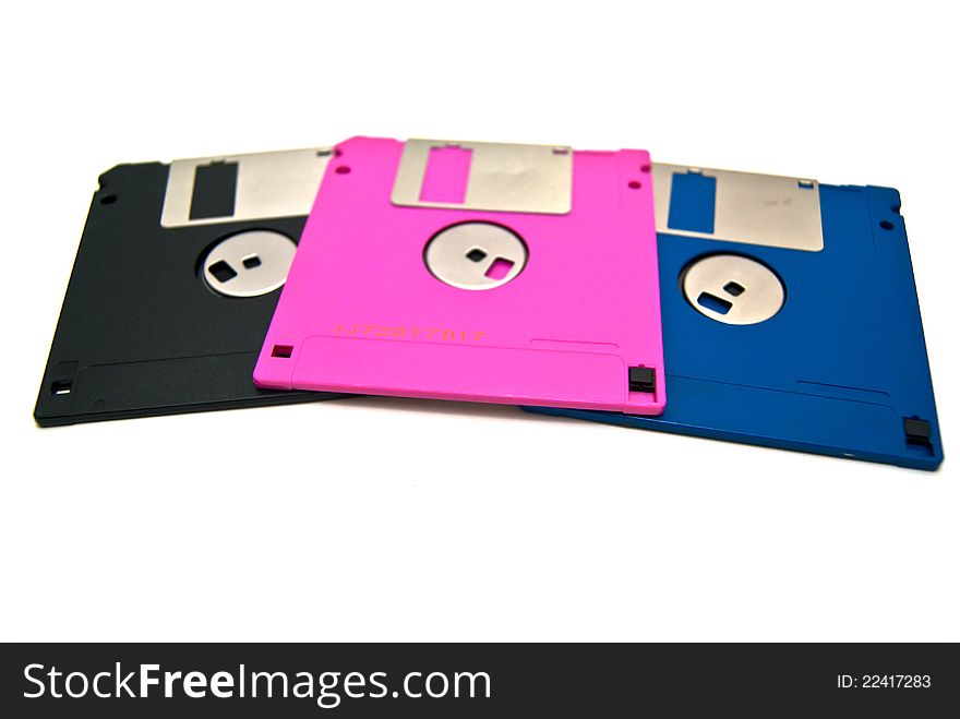 The different color diskettes on white