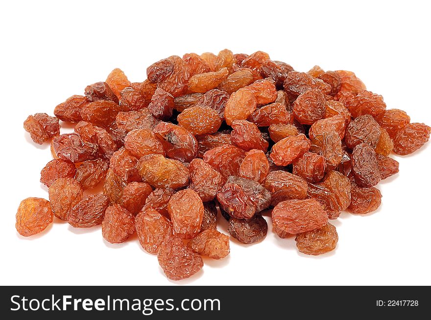 Brown raisins on a white background