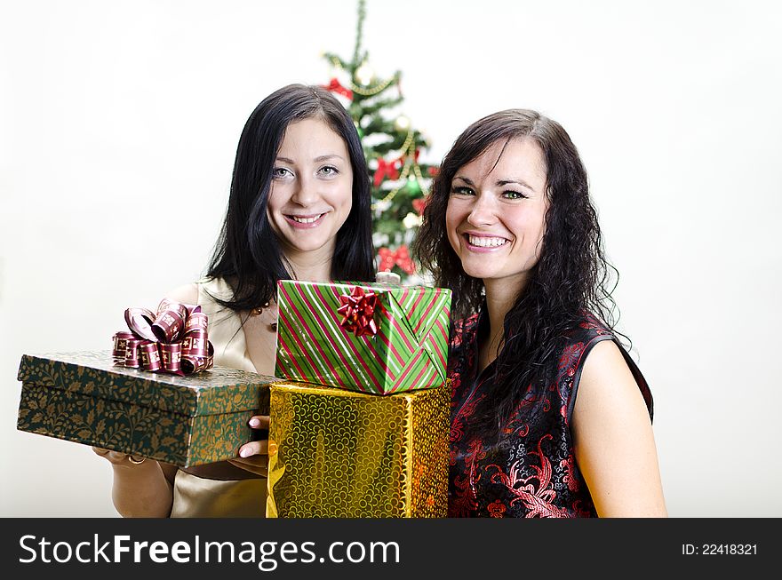 Christmas or new year party: Two girls with gifts. Christmas or new year party: Two girls with gifts