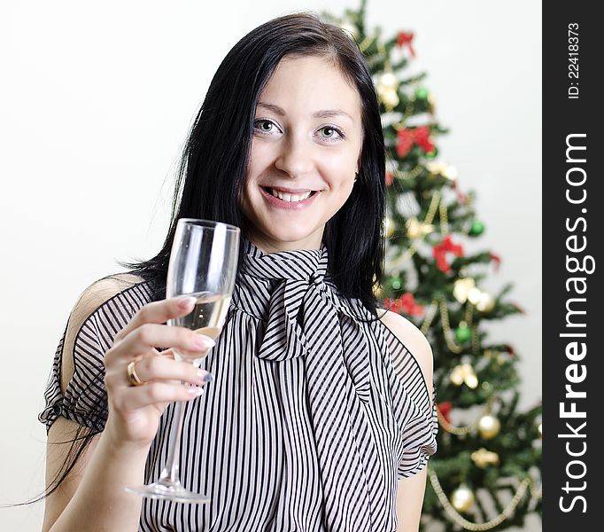 Christmas: girl congratulates with glass of wine