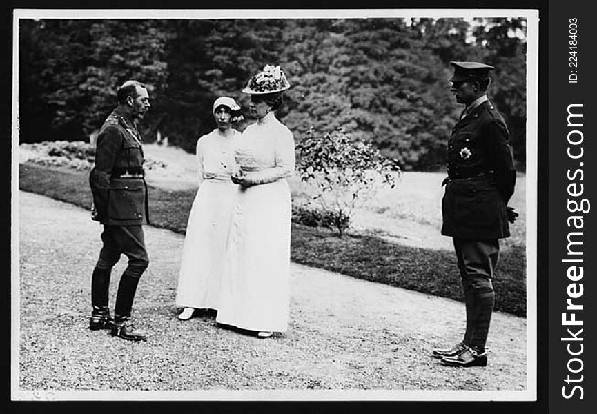 From left to right: King George V, Queen Elizabeth of Belgium, Queen Mary and King Albert I of Belgium. They are standing on a gravel path or driveway. Directly behind them a lawn slopes towards a row of trees. Both women are dressed in white and wearing hats. Queen Mary&#x27;s hat is adorned with flowers. 

During World War I royal families played an important ambassadorial role, forging and sustaining good relations between nations.

[Original reads: &#x27;ON THE BRITISH WESTERN FRONT IN FRANCE - Two King&#x27;s and two Queens [sic].&#x27;]

digital.nls.uk/74546724. From left to right: King George V, Queen Elizabeth of Belgium, Queen Mary and King Albert I of Belgium. They are standing on a gravel path or driveway. Directly behind them a lawn slopes towards a row of trees. Both women are dressed in white and wearing hats. Queen Mary&#x27;s hat is adorned with flowers. 

During World War I royal families played an important ambassadorial role, forging and sustaining good relations between nations.

[Original reads: &#x27;ON THE BRITISH WESTERN FRONT IN FRANCE - Two King&#x27;s and two Queens [sic].&#x27;]

digital.nls.uk/74546724