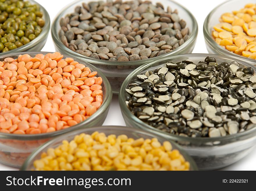 Grains pulses and beans in bowl isolated over white over
