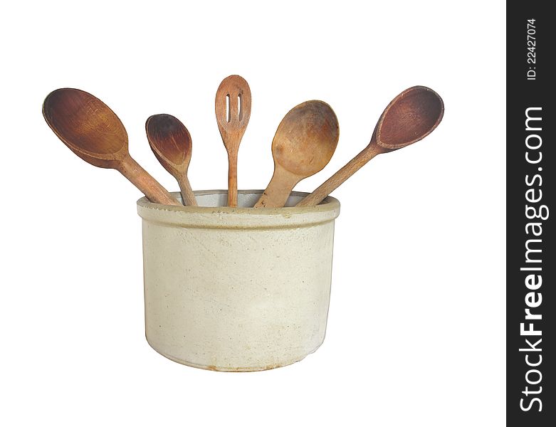 Vintage crock with five different worn wooden spoons. Isolated on white. Vintage crock with five different worn wooden spoons. Isolated on white.