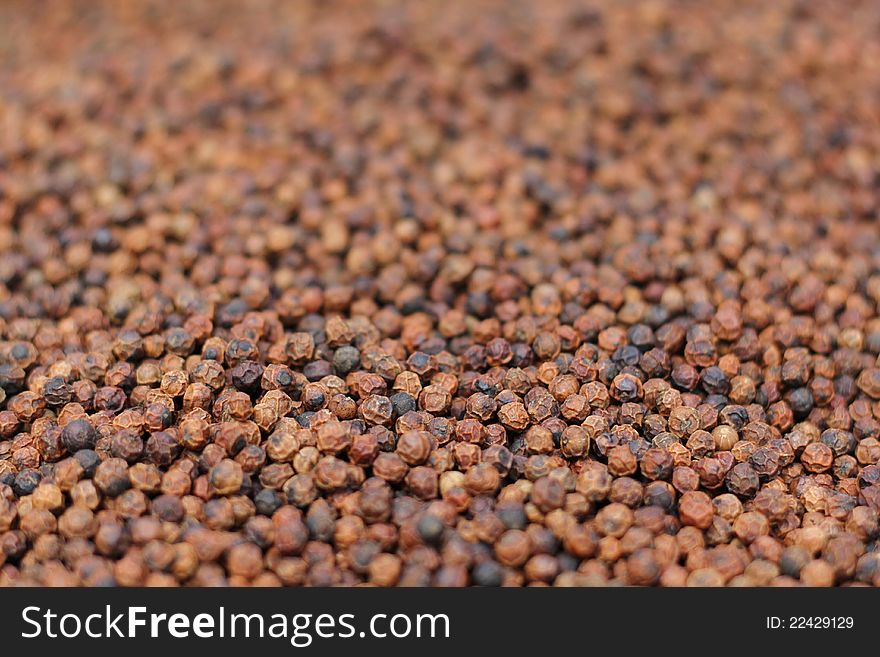 Close up detail of black pepper corns.