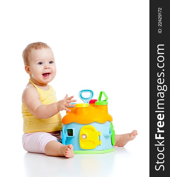 Cheerful baby girl with color educational toy. Cheerful baby girl with color educational toy