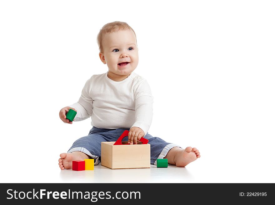 Cheerful baby girl with color educational toy. Cheerful baby girl with color educational toy