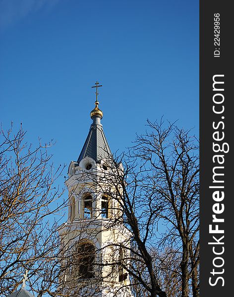 The bell tower of the cathedral of St. Andrew in Stavropol against the blue sky