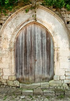 Old Closed Wooden Door With Concrete Arc Stock Image