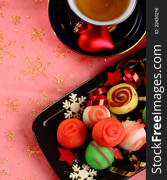 Christmas candies on red festive Christmas background