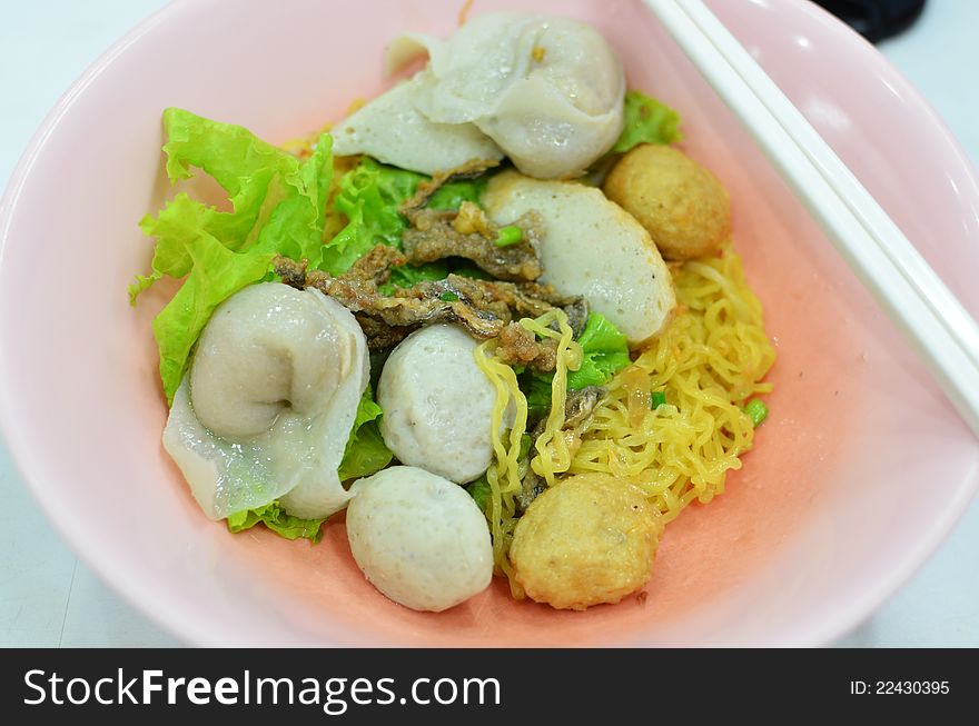 Asian style noodle with pork , fish ball and vegetables. Asian style noodle with pork , fish ball and vegetables