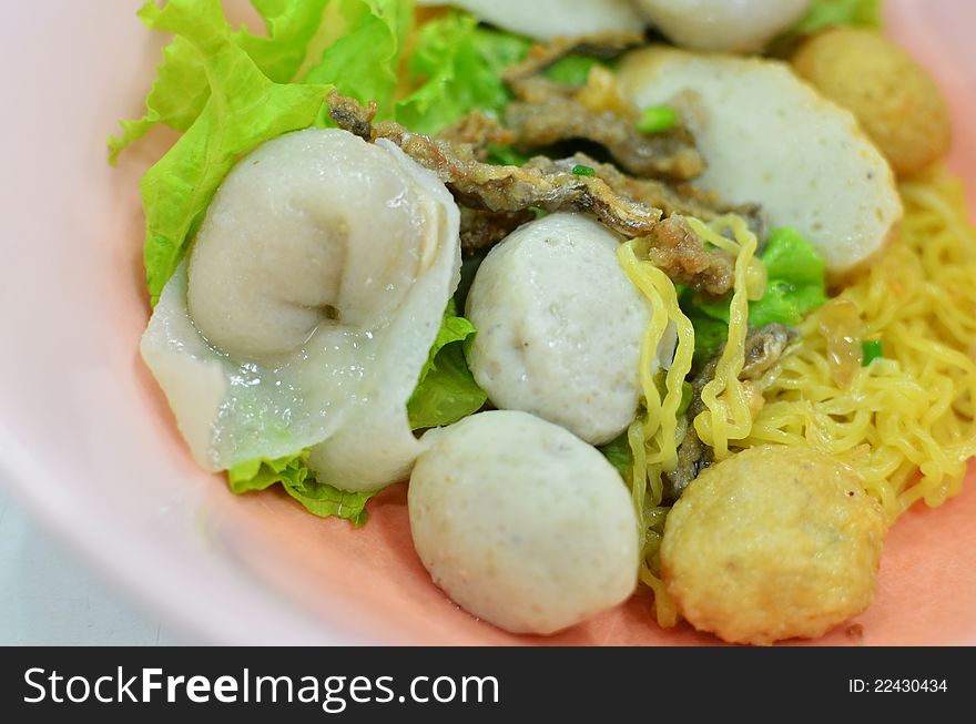 Asian style noodle with pork , fish ball and vegetables. Asian style noodle with pork , fish ball and vegetables