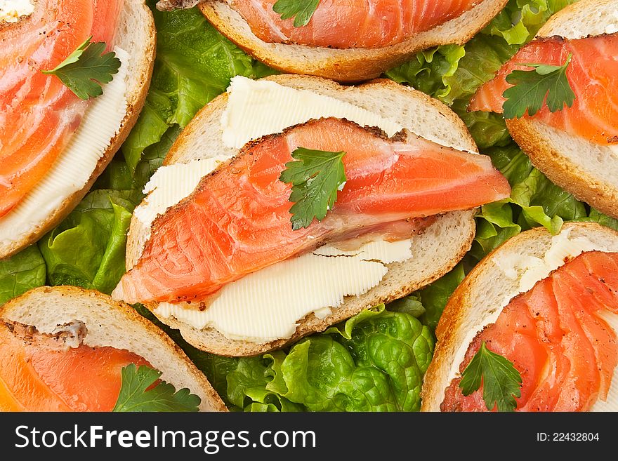 Salmon sandwiches on lettuce leaves