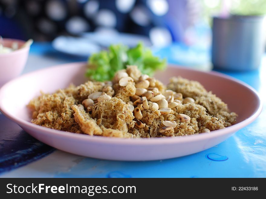 Spicy salad of fried minced fish