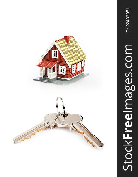 Keys and little house over white background. Keys and little house over white background.